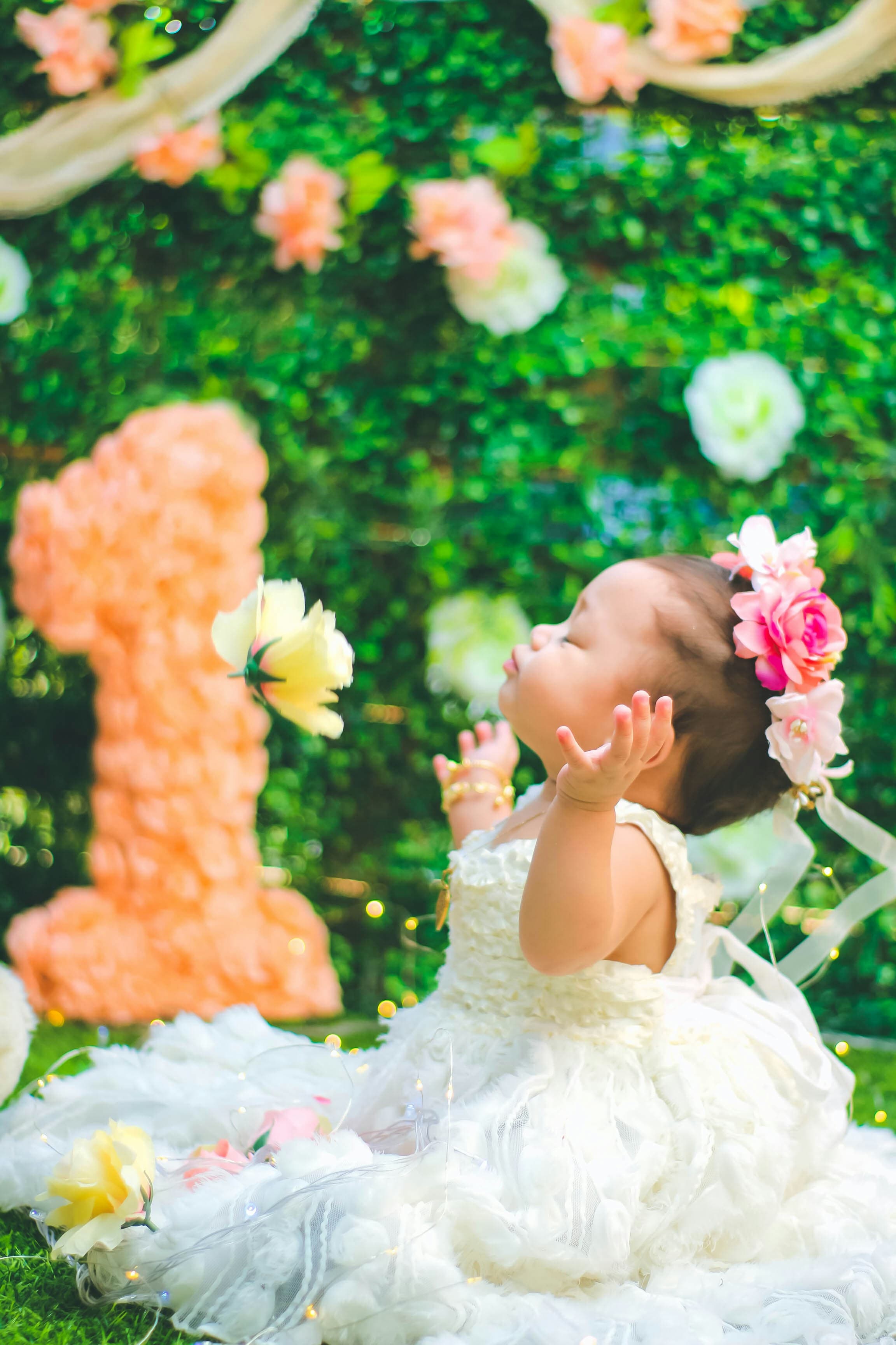Baby's first birthday floral decoration setup by Thoranam Decor
